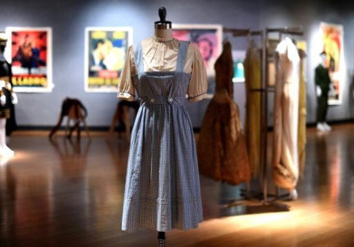 The iconic Wizard of Oz Dorothy dress goes for $1.56 million.